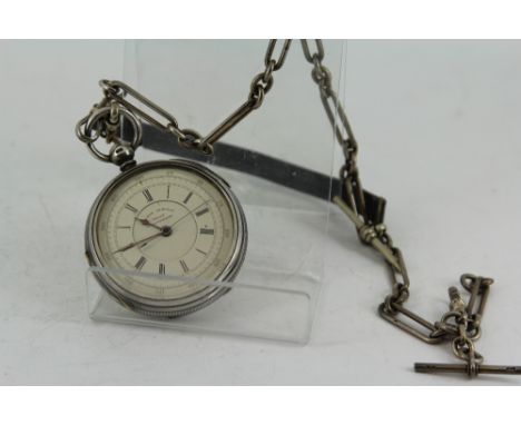 Hall marked silver cased key wind Centre Seconds chronograph pocket watch with enamel dial on silver Albert chain  