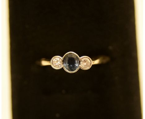 9ct gold 3 stone ring with 2 diamonds approx 0.10ct each and 1 blue stone 0.15 2.66g size: J 