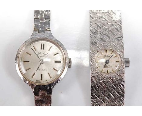 Two lady's white metal Pilot incabloc manual wind wristwatches, one with a round silvered baton dial and integral Milanese st
