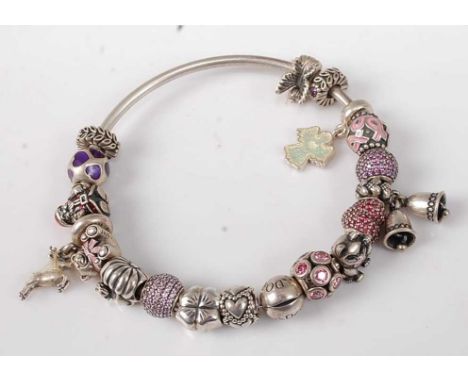 A Pandora silver bangle containing various Pandora silver and paste set charms, 67g