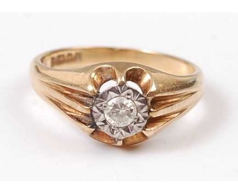 An 18ct yellow gold heavy set diamond single stone ring, comprising a round brilliant cut diamond in an illusion setting, wit