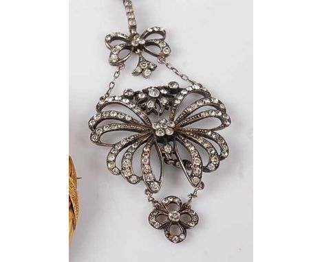 An Edwardian silver and paste set openwork pendant, arranged as three tiers, 7cm, on white metal double string neck chain