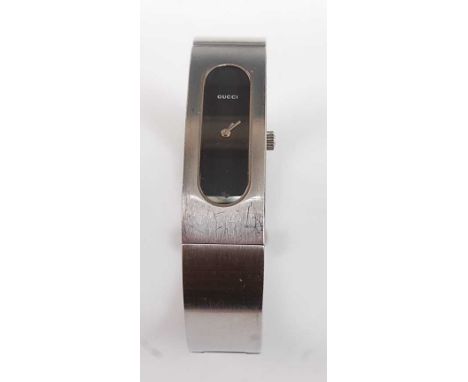 A lady's stainless steel Gucci bangle quartz wristwatch, with black oblong dial, overall length 190mm, width of bangle 15mm, 