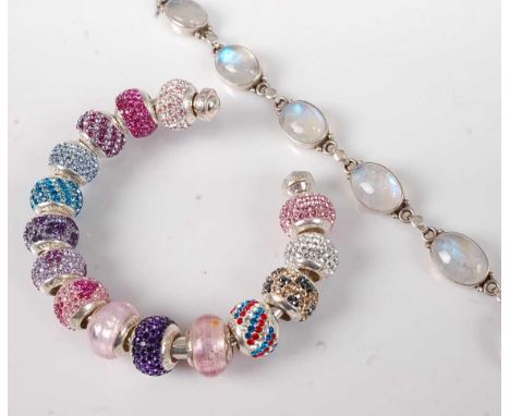 A Lovelinks silver torc bangle with various paste set silver charms; together with a modern silver and moonstone set bracelet