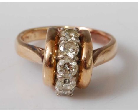 A yellow metal diamond five-stone ring, the five round brilliant cut diamonds claw set vertically in a curved mount, flanked 