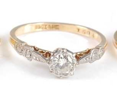 An 18ct gold diamond solitaire ring, the illusion set old brilliant weighing approx 0.25 carats, all with chased platinum sho