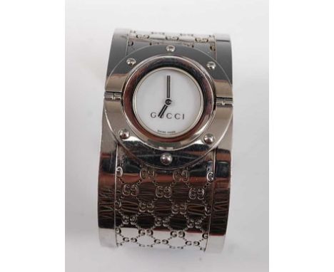 A lady's stainless steel Gucci 'Twirl' bangle wristwatch, with reversible dial, case diameter 23mm, overall length 185mm, wid