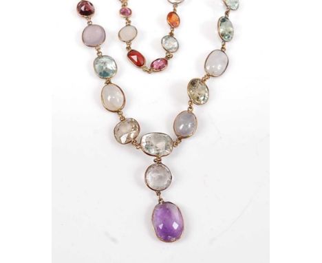 A yellow metal two row multi-stone necklace, featuring amethyst, aquamarine, garnet, topaz, citrine, blue zircon, pink tourma