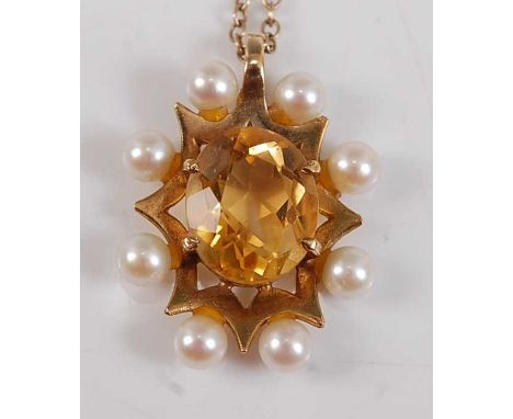 A 9ct yellow gold, citrine and pearl pendant, the oval faceted citrine within a sunburst border with eight approx 4.1mm cultu