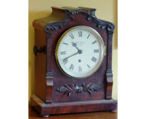 A late Regency period mahogany cased Bracket Clock, the cream enamel dial with Roman numerals and signed Thos. Dean, London, 