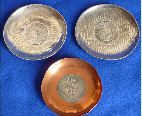 A pair of Chinese hand hammered white metal circular Trinket Dishes, each centrally inset with a Chinese one dollar coin, tog