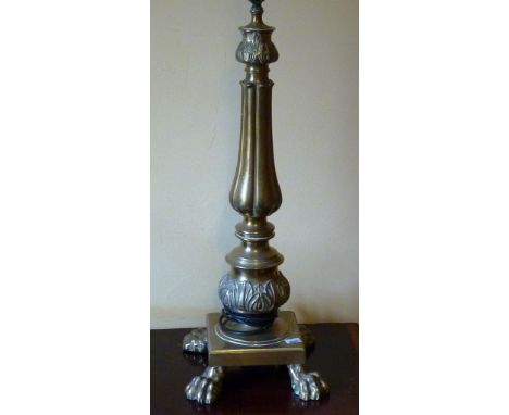A heavy Classical style Table Lamp (converted), elongated reeded baluster stem and on square platform base with four lion's p