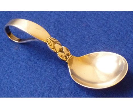 A Danish sterling silver Baby Feeder/Caddy Spoon made by Georg Jensen, the Spoon with scrolling loop handle and embellished w