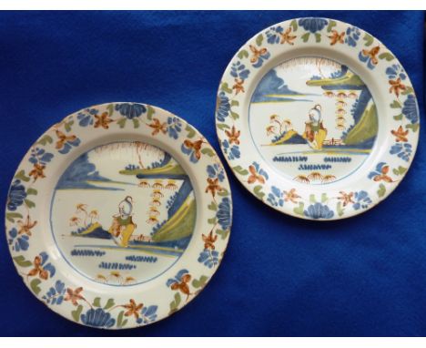 A pair of 18th Century small Delftware Plates each polychrome decorated with a single Chinaman within stylised exterior surro