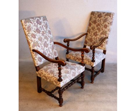 A good pair of early 20th Century stained wood and floral upholstered Armchairs of large proportions in William and Mary styl