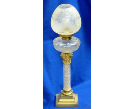 A large cut glass and gilt metal mounted Oil Lamp (converted) the ovoid shade with hand cut hobnail pattern against an etched