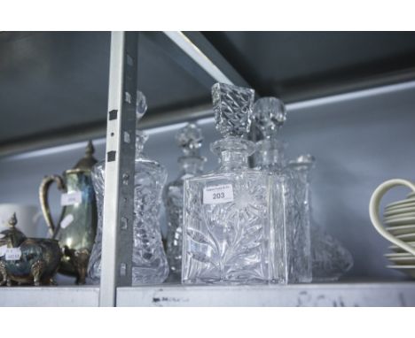 A PAIR OF CUT GLASS WAISTED DECANTERS, TWO RECTANGULAR SPIRIT DECANTERS AND A SHIPS DECANTER (5) 