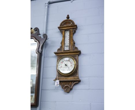 EARLY 1900s SMALL CARVED OAK CASED ANEROID BAROMETER WITH THERMOMETER, 23" (58.5cm) HIGH