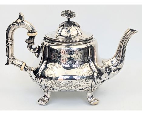 A late 19th century French silver teapot, screw in floral finial, vacant cartouche, marks to the body and interior lid edge, 