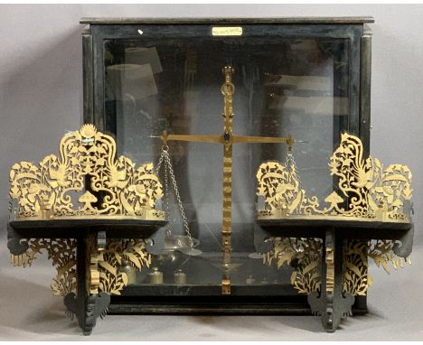 DE GRAVE SHORT CABINET SET OF BEAM SCALES and two fretwork gilt and ebonised wall bracket shelves, 55cms H, 55cms W, 28cms D 