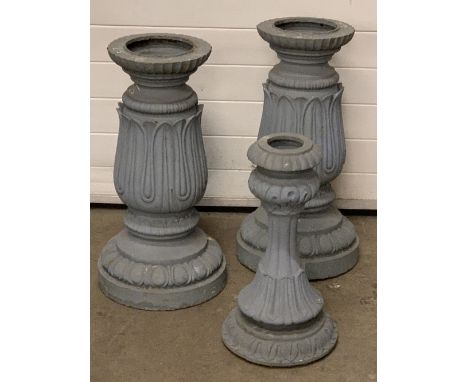 CAST IRON PLANTER STANDS, a pair plus one other, the pair having upturned acanthus leaf and egg and dart design to the circul