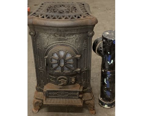 VINTAGE CAST IRON GAS STOVE with possibly associated flue attachments, 84cms H, 48cms W, 55cms D