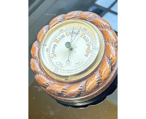 Round carved barometer 