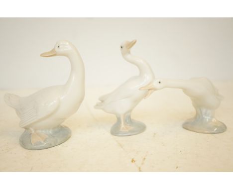 Two Lladro and one Nao geese 