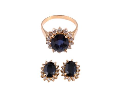 
	
		A SAPPHIRE AND DIAMOND CLUSTER RING AND EARRINGS 
		The cluster ring with a central oval cut sapphire within a surround 