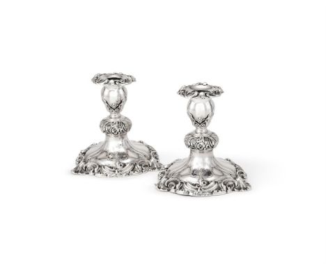 
	
		A PAIR OF VICTORIAN SILVER SHORT CANDLESTICKS
		CRESWICK &amp; CO., SHEFFIELD 1848
		With floral chased shaped circular 