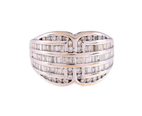 
	
		A DIAMOND DRESS RING 
		The 18 carat gold shaped panel set with brilliant cut and baguette cut diamonds, the shank with 
