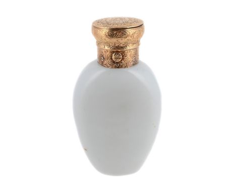 THOMAS DILLER OF LONDON, AN EARLY VICTORIAN OPAQUE GLASS SCENT BOTTLE  CIRCA 1840  The white glass body with scrolled floral 