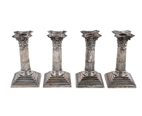 
	
		A SET OF FOUR EDWARDIAN SILVER SHORT CORINTHIAN COLUMN CANDLESTICKS
		WILLIAM HUTTON &amp; SONS LTD., LONDON 1907 (2) AN