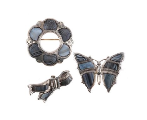 
	
		A VICTORIAN SCOTTISH MONTROSE AGATE BUTTERFLY AND TWO MONTROSE AGATE BROOCHES 
		The butterfly with polished agate set s