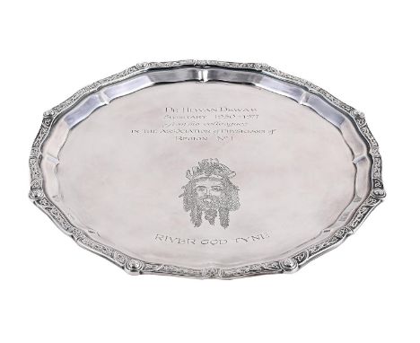 
	
		A SILVER SHAPED CIRCULAR SALVER
		C. J. VANDER LTD., SHEFFIELD 1970
		With a chased Celtic border and engraved with a pr