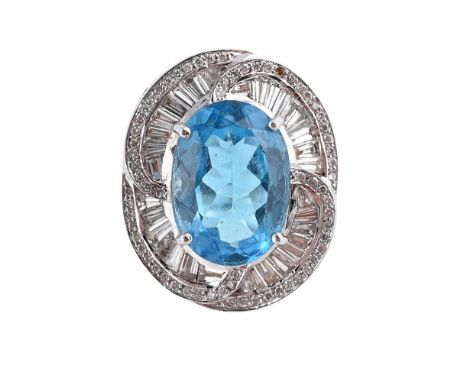 
	
		A BLUE TOPAZ AND DIAMOND DRESS RING
		The oval cut blue topaz within a scrolling surround of baguette cut diamonds with 