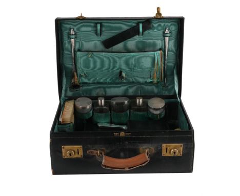 A LEATHER TRAVEL CASE WITH A SILVER MOUNTED DRESSING TABLE SET MAPPIN &amp; WEBB, LONDON 1931 The case with loop handle and f