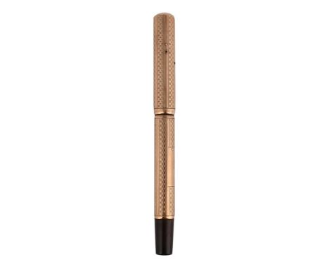 
	
		WATERMAN, IDEAL
		A 9 CARAT GOLD FOUNTAIN PEN, CIRCA 1926
		Cap and Barrel: 9 carat gold cap and barrel with engine turn