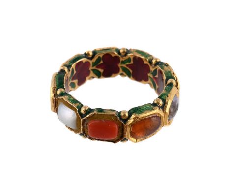 
	
		AN INDIAN NAVARATNA MULTI GEM RING  
		The ring with variously gem set panels, some with coloured foiled backs, the inte
