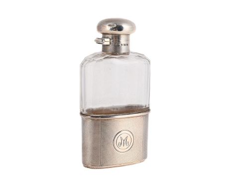 
	
		A SILVER MOUNTED AND GLASS SPIRIT FLASK
		ASPREY &amp; CO. LTD., LONDON 1917
		With engine turned decoration and engrave