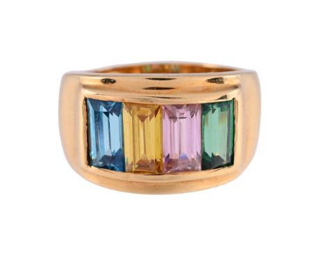 
	
		A GEM SET DRESS RING 
		The broad ring set with baguette cut synthetic coloured stones, the shank stamped 750 Premier wi