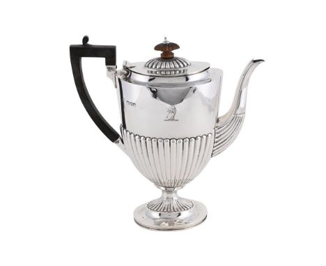 
	
		A LATE VICTORIAN SILVER COFFEE POT
		CHARLES STUART HARRIS, LONDON 1899
		With a wooden lobed oval finial and angular ha