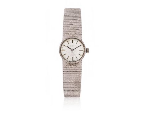 
	
		LONGINES
		A LADY&#39;S 9 CARAT WHITE GOLD BRACELET WATCH, CIRCA 1974
		Movement: Cal. 5601, manual wind, 17 jewels
		Ca