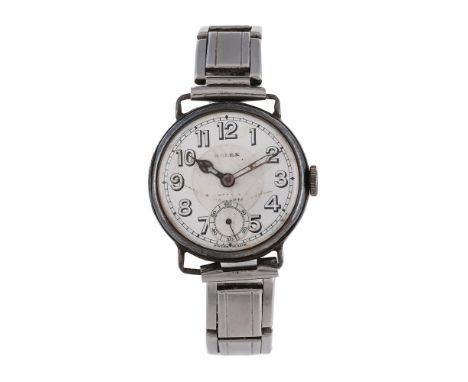 
	
		ROLEX
		A SILVER WRISTWATCH, NO. 63056 51, CIRCA 1927
		Movement: Manual wind, 15 jewels
		Case: Silver case, snap case 