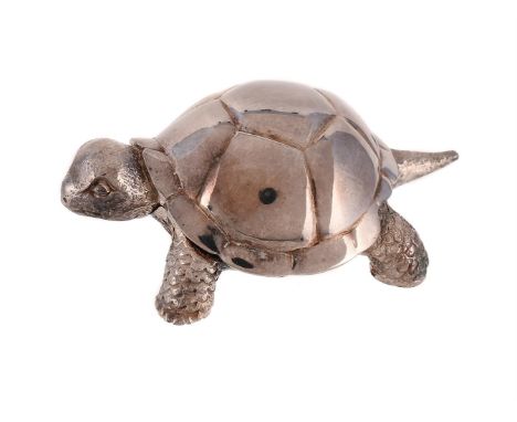 
	
		A CASED SILVER TORTOISE TAPE MEASURE 
		GARRARD &amp; CO. LTD., LONDON 1995
		One foot which pulls out to reveal a tape 