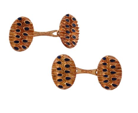 
	
		 A PAIR OF 1970S ENAMELLED CUFFLINKS
		The oval panels with blue enamelled decoration, to baton shaped links, stamped 75