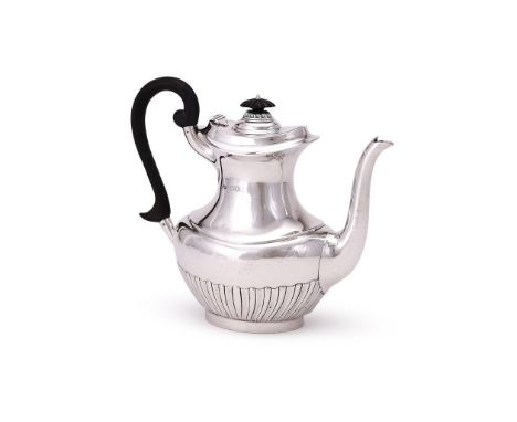 
	
		AN EDWARDIAN SILVER OVAL BALUSTER COFFEE POT
		GOLDSMITHS &amp; SILVERSMITHS CO. LTD., LONDON 1904
		With wooden oval fi