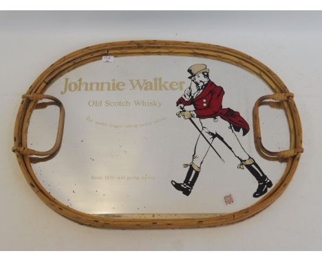 An oval mirrored tray advertising Johnnie Walker Old Scotch Whiskey, 15 1/2 x 11 1/4".