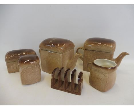 A group of Hovis advertising ceramics comprising two teapots, a butter dish, a toastrack, a mug and a sugar bowl, all by Carl