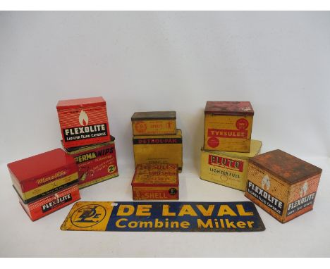 A collection of lighter fuel tins including Shell, plus a De Laval Combine Milker double sided tin advertising sign.